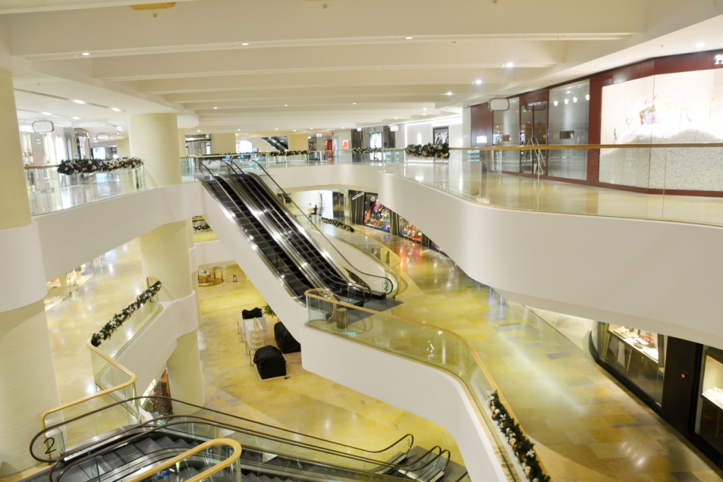 Modern shopping mall with escalators.